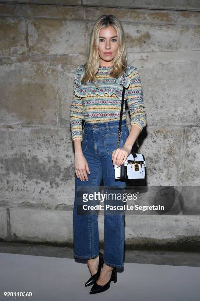 Sienna Miller attends the Louis Vuitton show as part of the Paris Fashion Week Womenswear Fall/Winter 2018/2019 on March 6, 2018 in Paris, France.