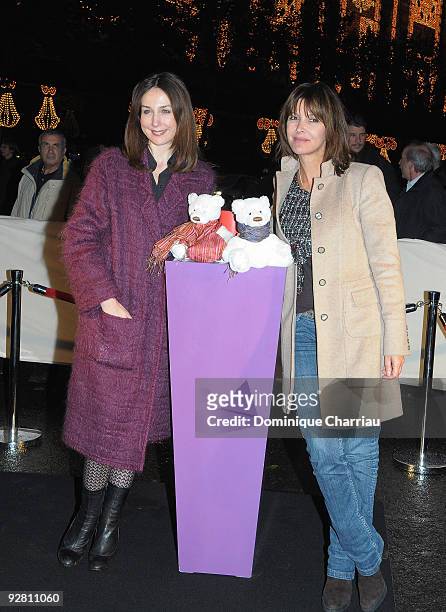French actress Elsa Zylberstein and journalist Tina Kieffer attend the launch of the Christmas windows animations and lights at Galeries Lafayette on...