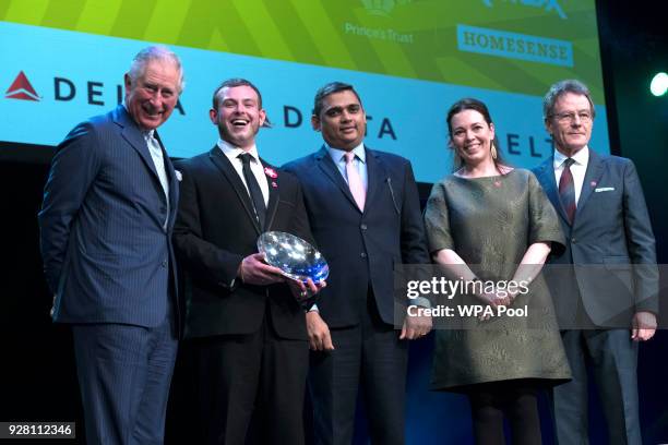 Prince Charles, Prince of Wales poses for a photograph with Delta Air Lines Rising Star Award winner Jack Hamblett at The Prince's Trust Awards at...