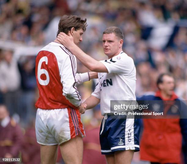 Paul Gascoigne of Tottenham Hotspur embraces Tony Adams of Arsenal after the FA Cup Semi Final at Wembley Stadium on April 14, 1991 in London,...