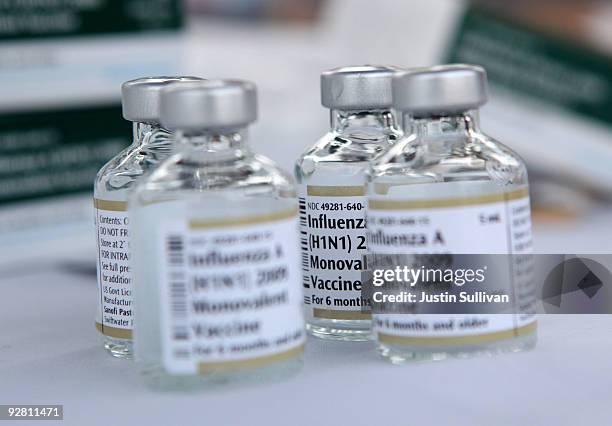 Empty vials of H1N1 vaccine sit on a table during a drive thru H1N1 vaccination clinic at Doctor's Medical Center November 5, 2009 in San Pablo,...