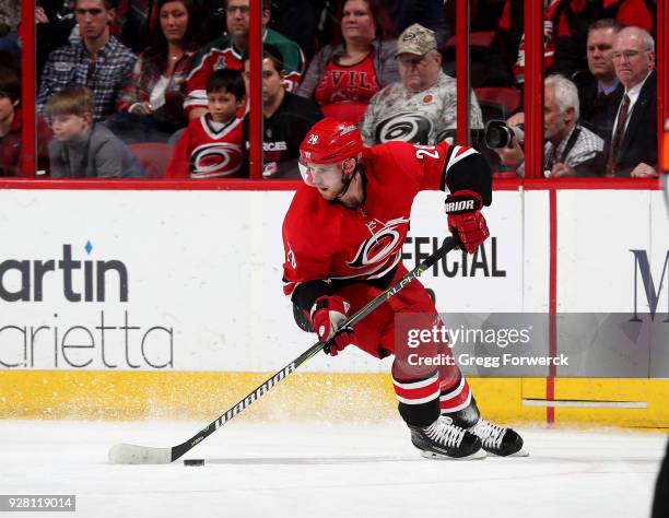 Elias Lindholm of the Carolina Hurricanes controls the puck on the ic during an NHL game against the New Jersey Devils on February 18, 2018 at PNC...