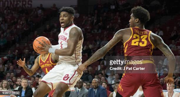 Oklahoma Sooners guard Rashard Odomes shoots over Iowa State players during the second half of a NCAA college basketball game at the Lloyd Noble...