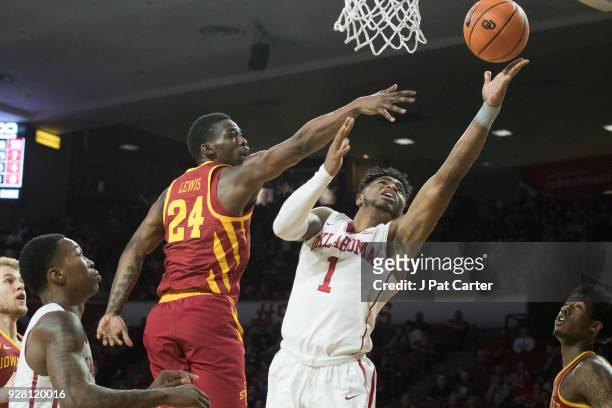 Iowa State Cyclones guard Terrence Lewis blocks Oklahoma Sooners guard Rashard Odomes during the second half of a NCAA college basketball game at the...