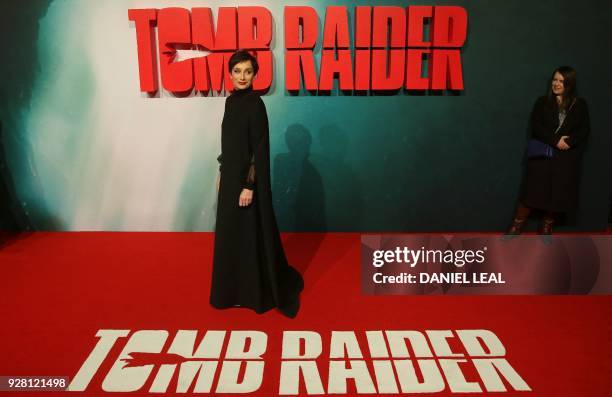 British actress Kristin Scott Thomas poses on the red carpet upon arrival to attend the European premiere of the film Tomb Raider, in London on March...