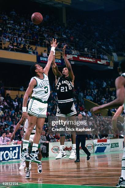 Alvin Robertson of the San Antonio Spurs shoots over Dennis Johnson of the Boston Celtics during a game played in 1989 at the Boston Garden in...