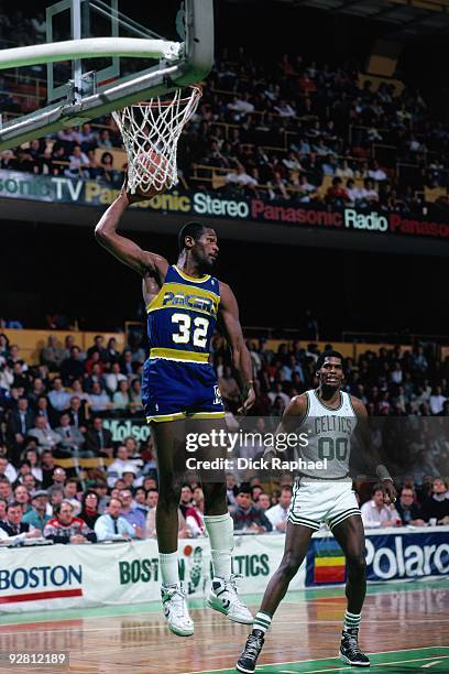 Herb Williams of the Indiana Pacers rebounds against the Boston Celtics during a game played in 1989 at the Boston Garden in Boston, Massachusetts....