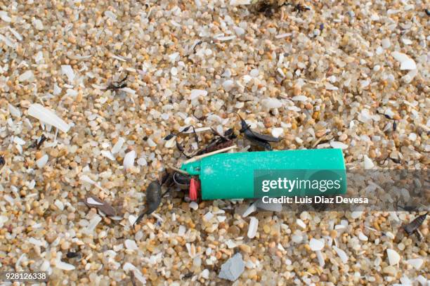 coastline pollution, cigarette lighter - green lighter stock pictures, royalty-free photos & images