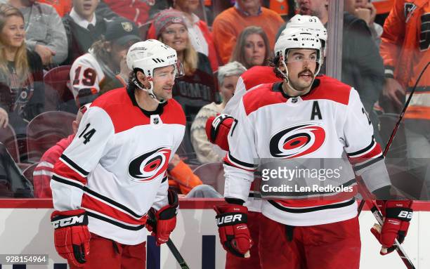 Justin Williams and Justin Faulk of the Carolina Hurricanes react following a third period goal by Sebastian Aho against the Philadelphia Flyers with...
