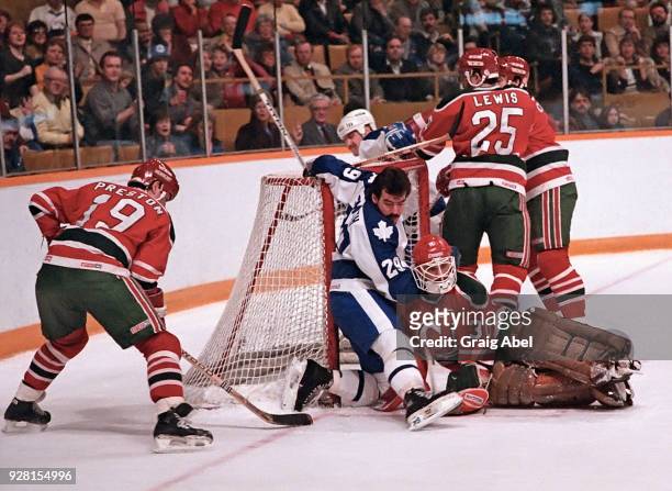 Brad Smith and Wendel Clark of the Toronto Maple Leafs skate against Rich Preston, Dave Lewis and Alain Chevrier of the New Jersey Devils during NHL...
