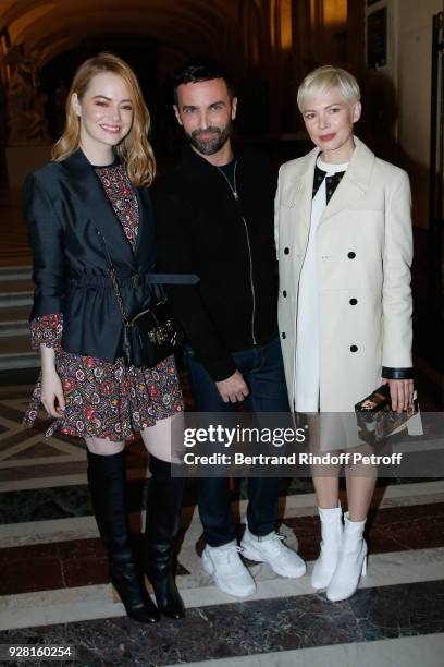 Emma Stone, Stylist Nicolas Ghesquiere and Michelle Williams pose after the Louis Vuitton show as part of the Paris Fashion Week Womenswear...