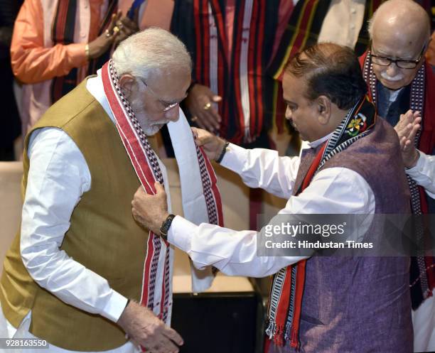 Union Minister of Chemicals and Fertilizers and parliamentary affairs Ananth Kumar greets Prime Minister Narendra Modi during attending the BJP...