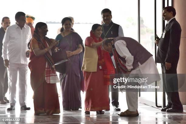 Union Minister Ananth Kumar seeking blessing from Sushma Swaraj at Literary Building during the Parliament Budget Session on March 6, 2018 in New...