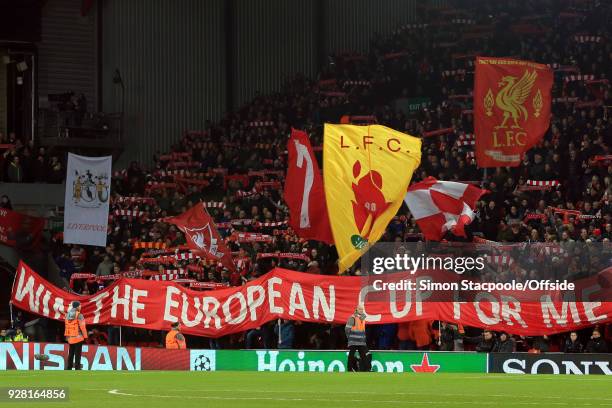 Liverpool fans hold a giant banner reading "Win the European Cup for me" during the UEFA Champions League Round of 16 Second Leg match between...