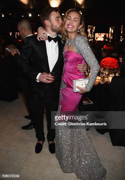 Gus Kenworthy and Miley Cyrus attend the 26th annual Elton John AIDS Foundation Academy Awards Viewing Party sponsored by Bulgari, celebrating EJAF...
