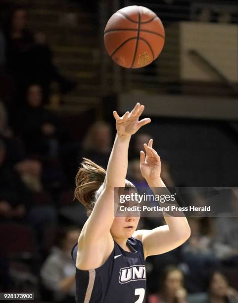 Brittni Lai of the University of New Hampshire puts up a three-pointer during an American East Women's quarterfinal game against Stony Brook...