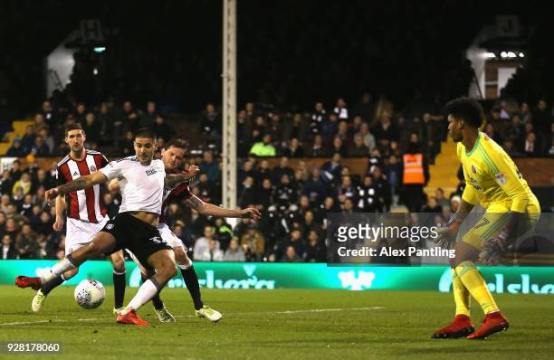 Aleksandar Mitrovic of Fulham scores his sides first goal during the Sky Bet Championship match between Fulham and Sheffield United at Craven Cottage...
