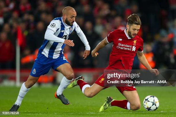 Andre Andre of FC Porto and Adam Lallana of Liverpool during the UEFA Champions League Round of 16 Second Leg match between Liverpool and FC Porto at...