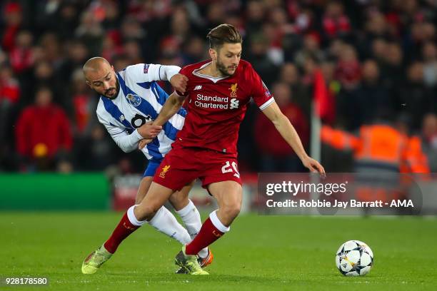 Andre Andre of FC Porto and Adam Lallana of Liverpool during the UEFA Champions League Round of 16 Second Leg match between Liverpool and FC Porto at...