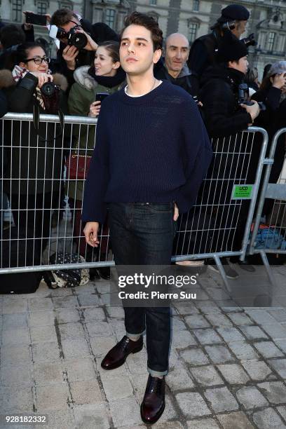 Xavier Dolan attends the Louis Vuitton show as part of the Paris Fashion Week Womenswear Fall/Winter 2018/2019 on March 6, 2018 in Paris, France.