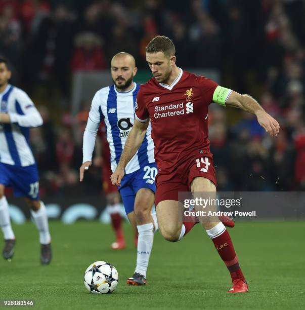 Jordan Henderson of Liverpool with Andre Andre of FC Porto during the UEFA Champions League Round of 16 Second Leg match between Liverpool and FC...