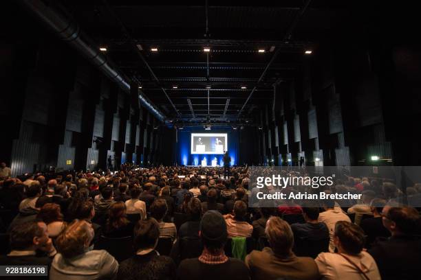 People attend an event hosted by the right-wing Swiss weekly magazine Die Weltwoche attended by Steve Bannon, the former chief strategist for U.S....