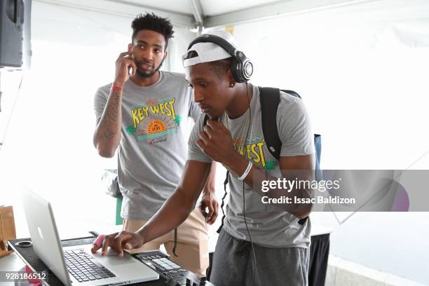 Derrick Jones Jr. #5 and Josh Richardson of the Miami Heat participate in the 2018 Family Festival at the American Airlines Area on March 4, 2018 in...