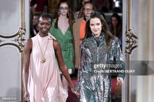 Models present creations for Paul & Joe during the 2018/2019 fall/winter collection fashion show on March 6, 2018 in Paris. / AFP PHOTO / BERTRAND...