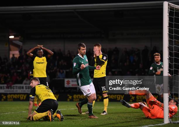 Andreas Bjelland of Brentford celebrates his sides first goal as Kyle McFadzean of Burton Albion scores a own goal during the Sky Bet Championship...