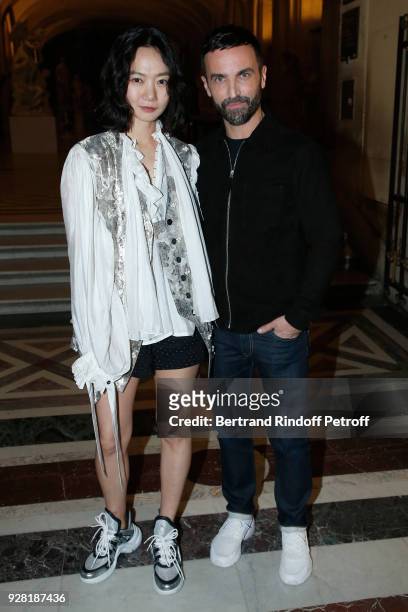 Bae Doona and Stylist Nicolas Ghesquiere pose after the Louis Vuitton show as part of the Paris Fashion Week Womenswear Fall/Winter 2018/2019 on...