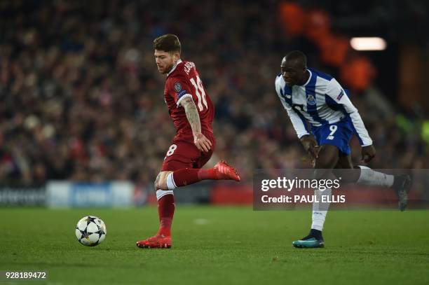 Liverpool's Spanish defender Alberto Moreno vies with Porto's Cameroonian striker Vincent Aboubakar during the UEFA Champions League round of sixteen...