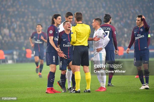 Marco Verratti of PSG receives a second yellow card, and hence a red card, from referee Felix Brych during the UEFA Champions League Round of 16...