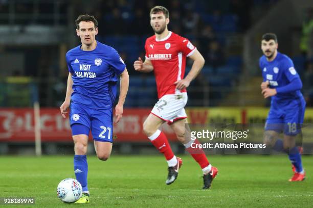 Craig Bryson of Cardiff City is marked by Gary Gardner of Barnsley during the Sky Bet Championship match between Cardiff City and Barnsley at the...