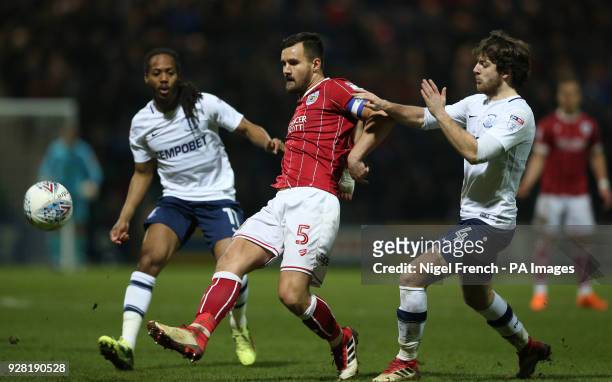Preston North End's Ben Pearson and Bristol City's Bailey Wright battle for the ball during the Sky Bet Championship match at Deepdale, Preston.