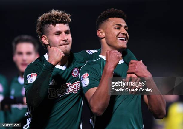 Ollie Watkins of Brentford celebrates after scoring his sides second goal with Emiliano Macrondes of Brentford during the Sky Bet Championship match...
