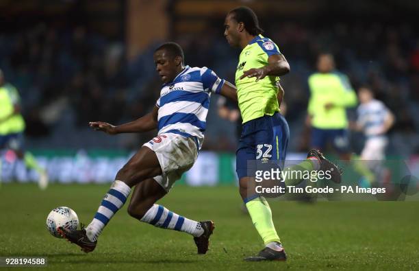Queens Park Rangers' Nedum Onuoha and Derby County's Cameron Jerome battle for the ball during the Sky Bet Championship match at Loftus Road, London.