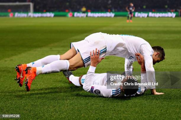 Casemiro of Real Madrid is jumped on by teammate Cristiano Ronaldo to celebrate scoring his sides second goal during the UEFA Champions League Round...