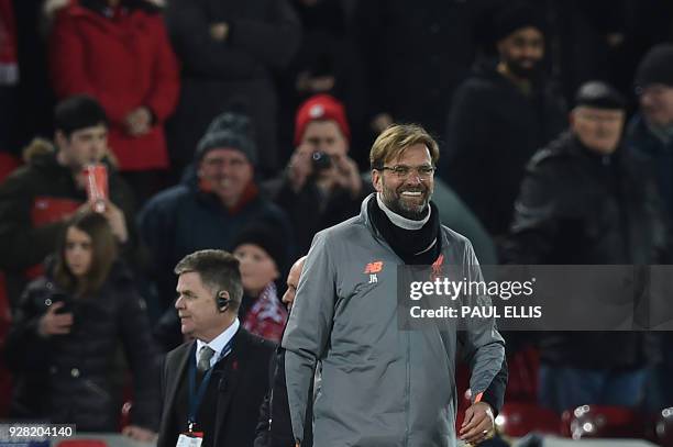 Liverpool's German manager Jurgen Klopp gestures after the UEFA Champions League round of sixteen second leg football match between Liverpool and FC...