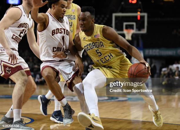 Georgia Tech Yellow Jackets guard Josh Okogie drives on Boston College Eagles guard Jerome Robinson during the ACC men's tournament game between the...