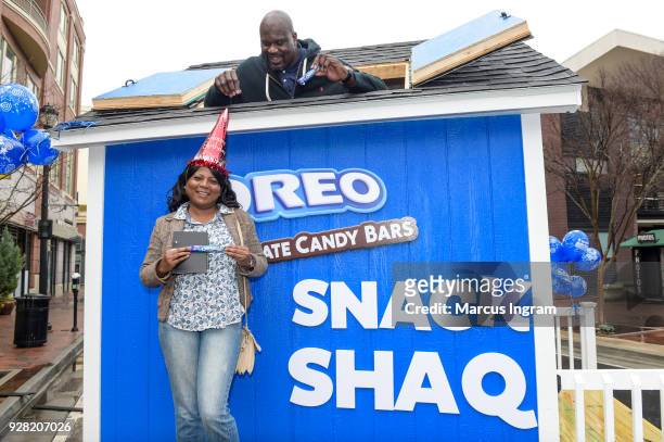Basketball Hall of Famer Shaquille ONeal hands out free OREO Chocolate Candy Bars at the Snack Shaq to kick off his shared birthday with OREO March...