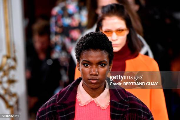 Models presents creations for Paul & Joe during the 2018/2019 fall/winter collection fashion show on March 6, 2018 in Paris. / AFP PHOTO / BERTRAND...