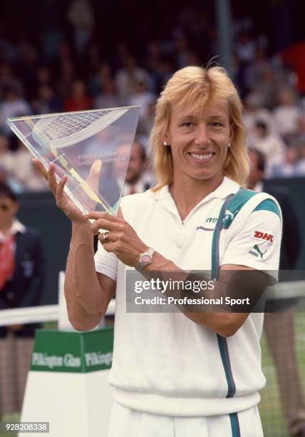 Martina Navratilova of the USA poses with the trophy after defeating Natasha Zvereva of the Soviet Union in the Singles Final of the Pilkington Glass...