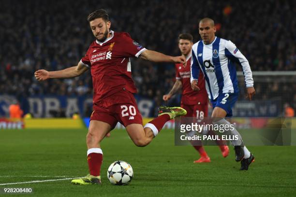 Liverpool's English midfielder Adam Lallana controls the ball during the UEFA Champions League round of sixteen second leg football match between...