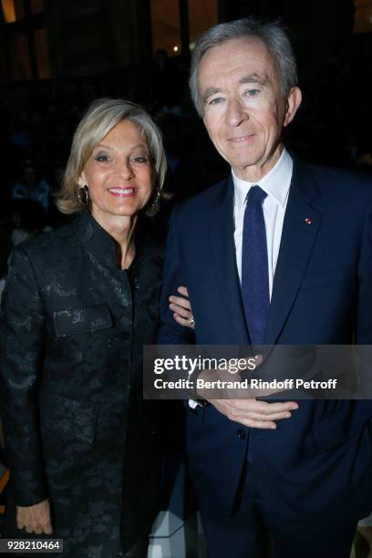 Owner of LVMH Luxury Group Bernard Arnault and his wife Helene Arnault attend the Louis Vuitton show as part of the Paris Fashion Week Womenswear...