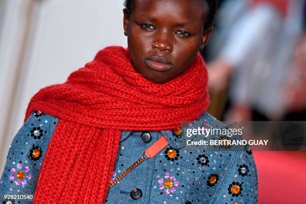 Model presents a creation for Paul & Joe during the 2018/2019 fall/winter collection fashion show on March 6, 2018 in Paris. / AFP PHOTO / BERTRAND...