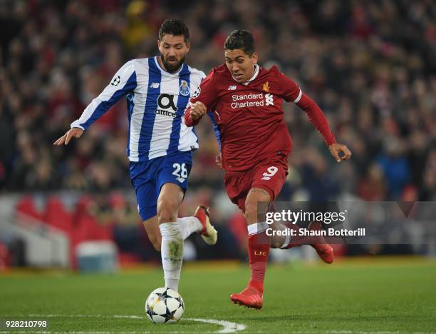 Roberto Firmino of Liverpool is challenged by Felipe of FC Porto during the UEFA Champions League Round of 16 second leg match between Liverpool and...
