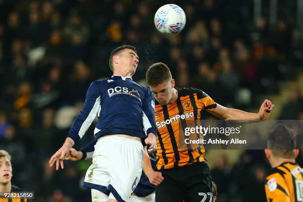 Shaun Williams of Millwall FC wins the header from Markus Henriksen during the Sky Bet Championship match between Hull City and Millwall FC at KCOM...
