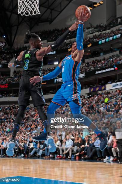 Nerlens Noel of the Dallas Mavericks defends against Russell Westbrook of the Oklahoma City Thunder during the game between the two teams on February...