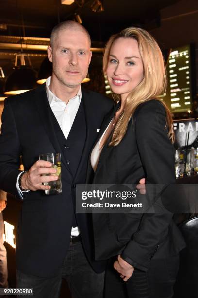 Jean-David Malat and Noelle Reno attend the opening of "FRAME", an exhibition of photographs by Alan Chapman, at BXR London on March 6, 2018 in...