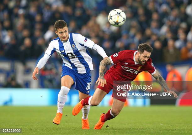 Diogo Dalot of FC Porto fouls Danny Ings of Liverpool during the UEFA Champions League Round of 16 Second Leg match between Liverpool and FC Porto at...